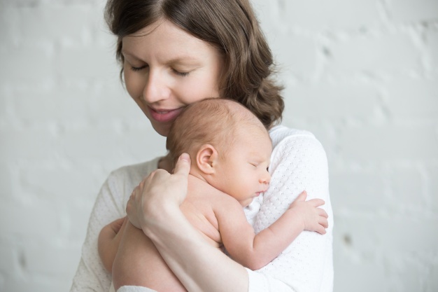 woman nurtures baby in san antonio